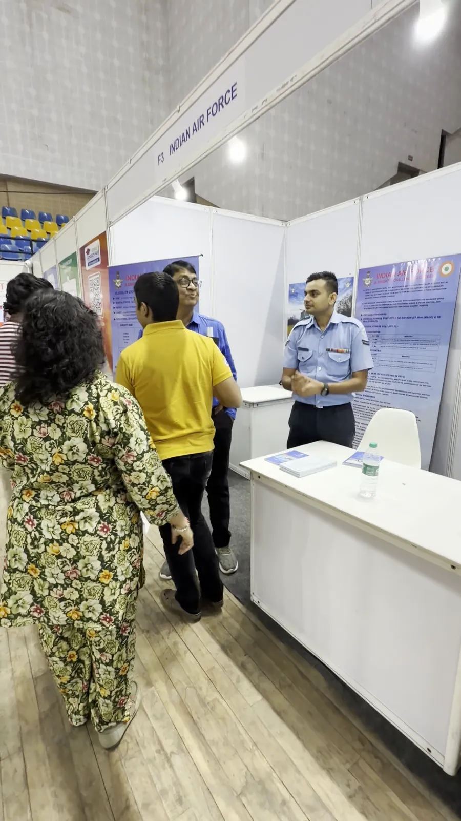 Visitors reading display boards at the Indian Air Force stall.
