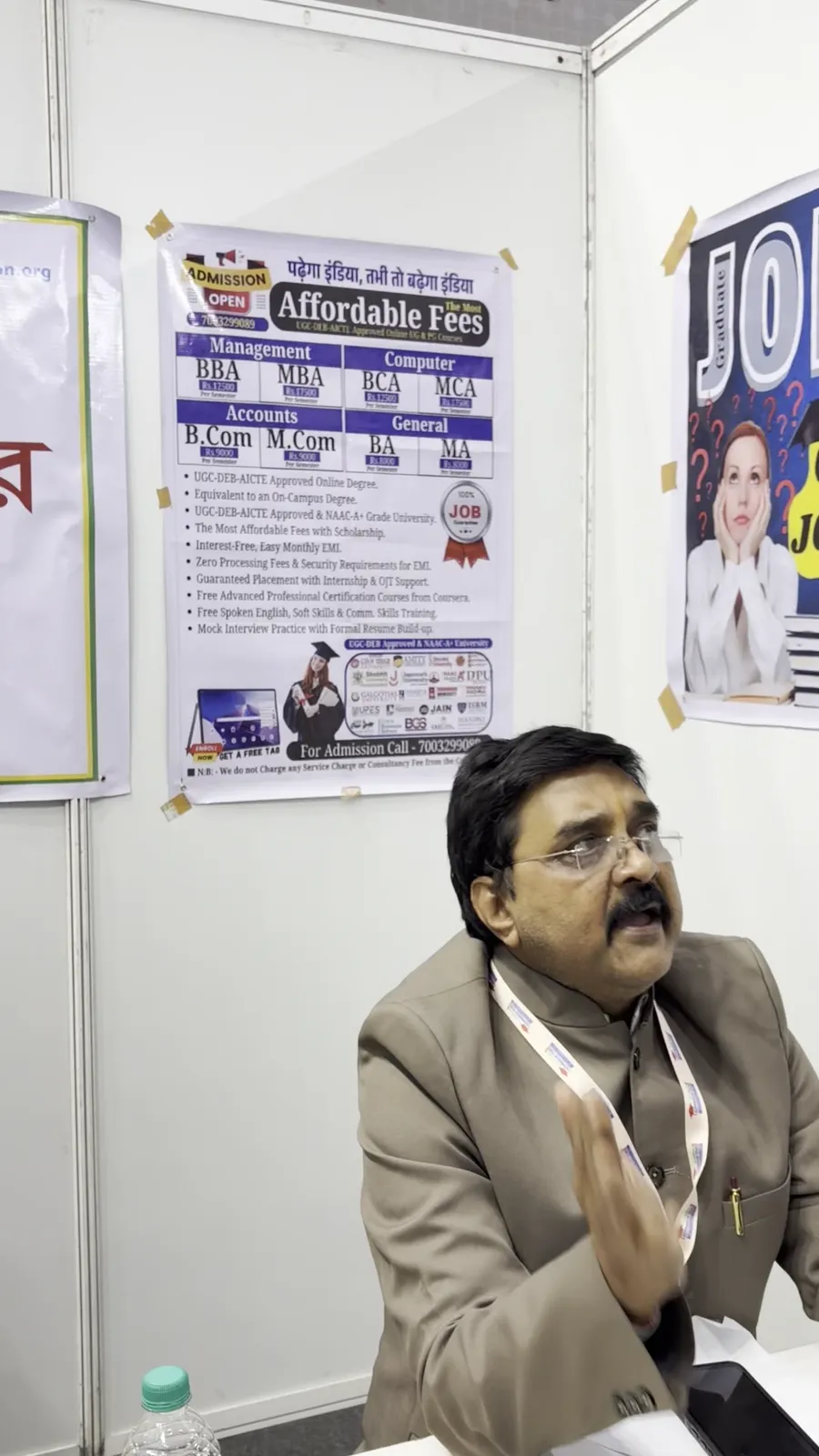 An adviser mid conversation at a career guidance stall.