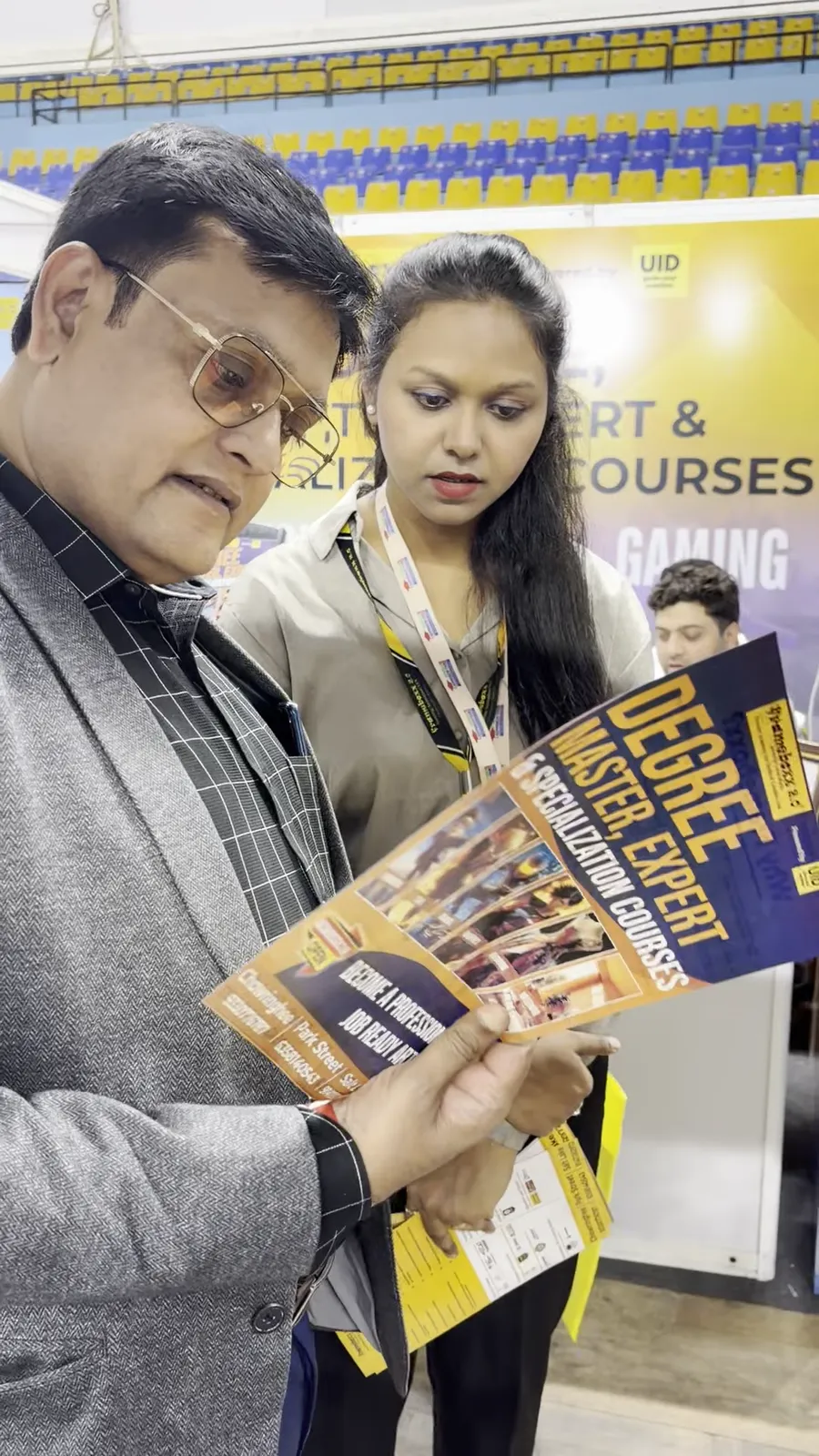 A visitor holding several school prospectuses and leaflets.